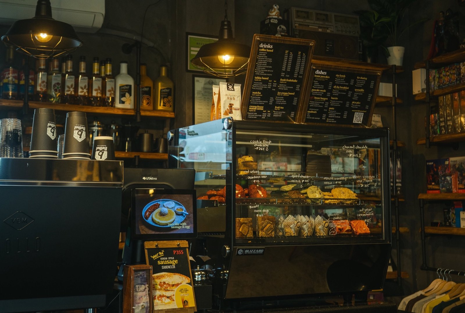 The café counter, pastry case, and menu